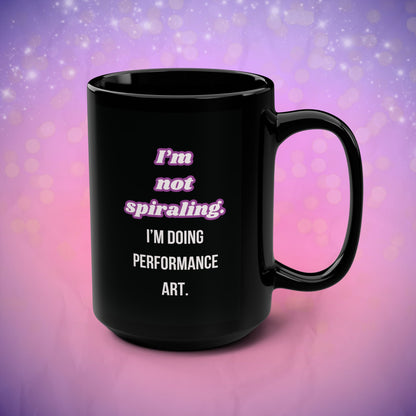 Black mug with text on a purple and pink gradient background