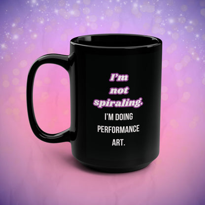Black mug with text on a purple and pink gradient background