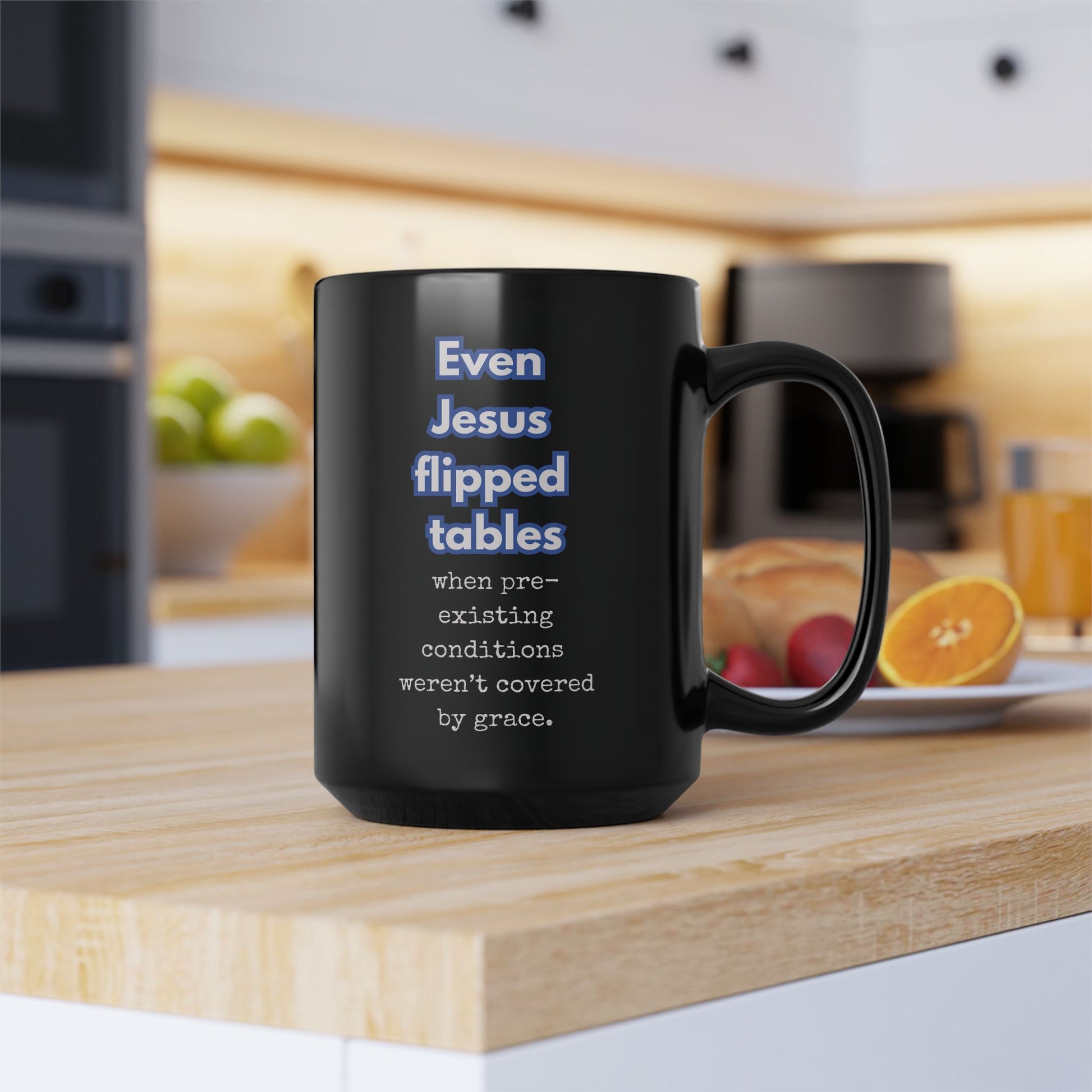 Black mug with text on a kitchen counter