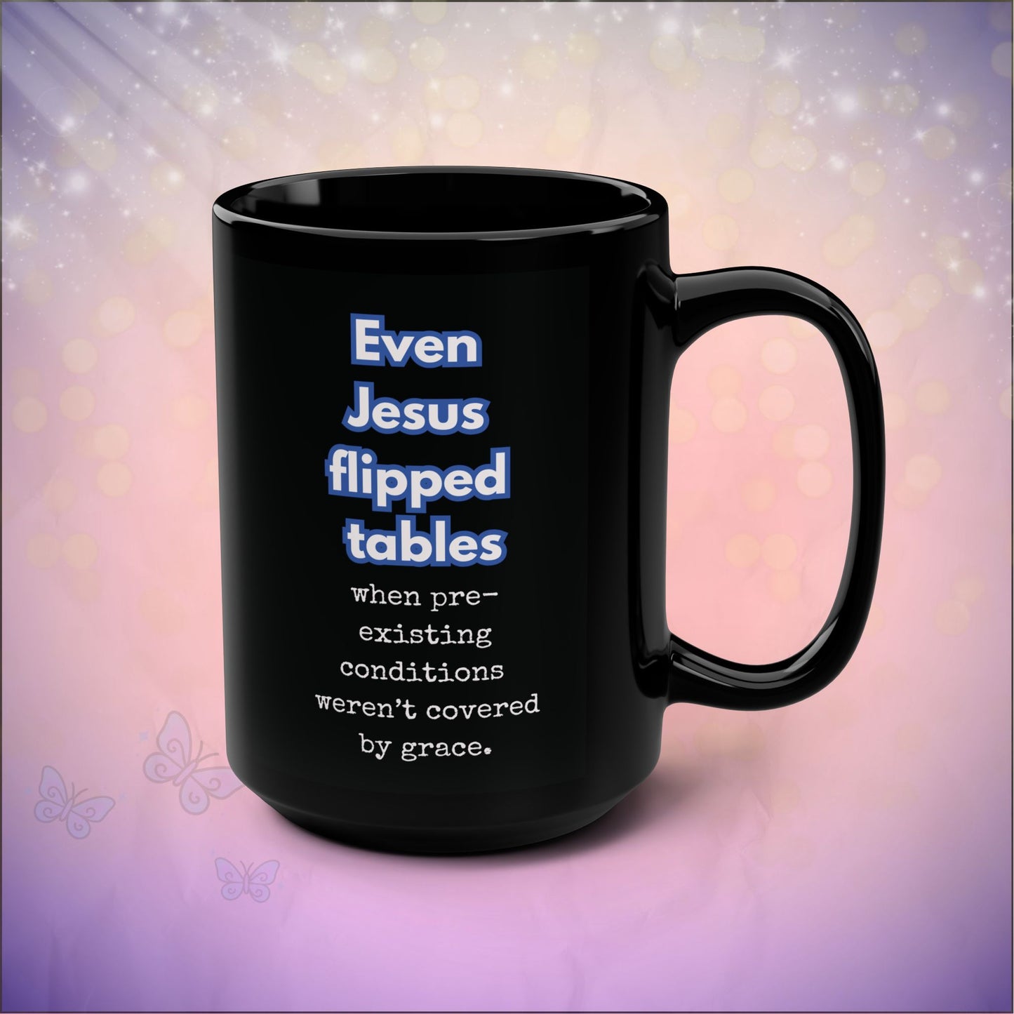 Black mug with humorous text on a blurred background
