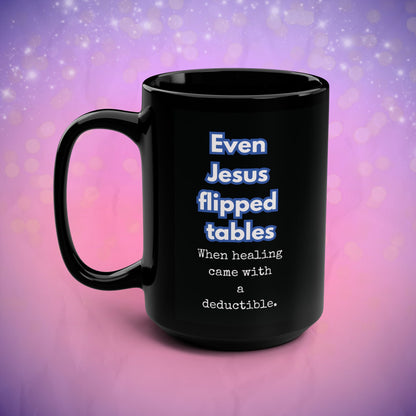 Black mug with humorous text on a gradient purple and pink background