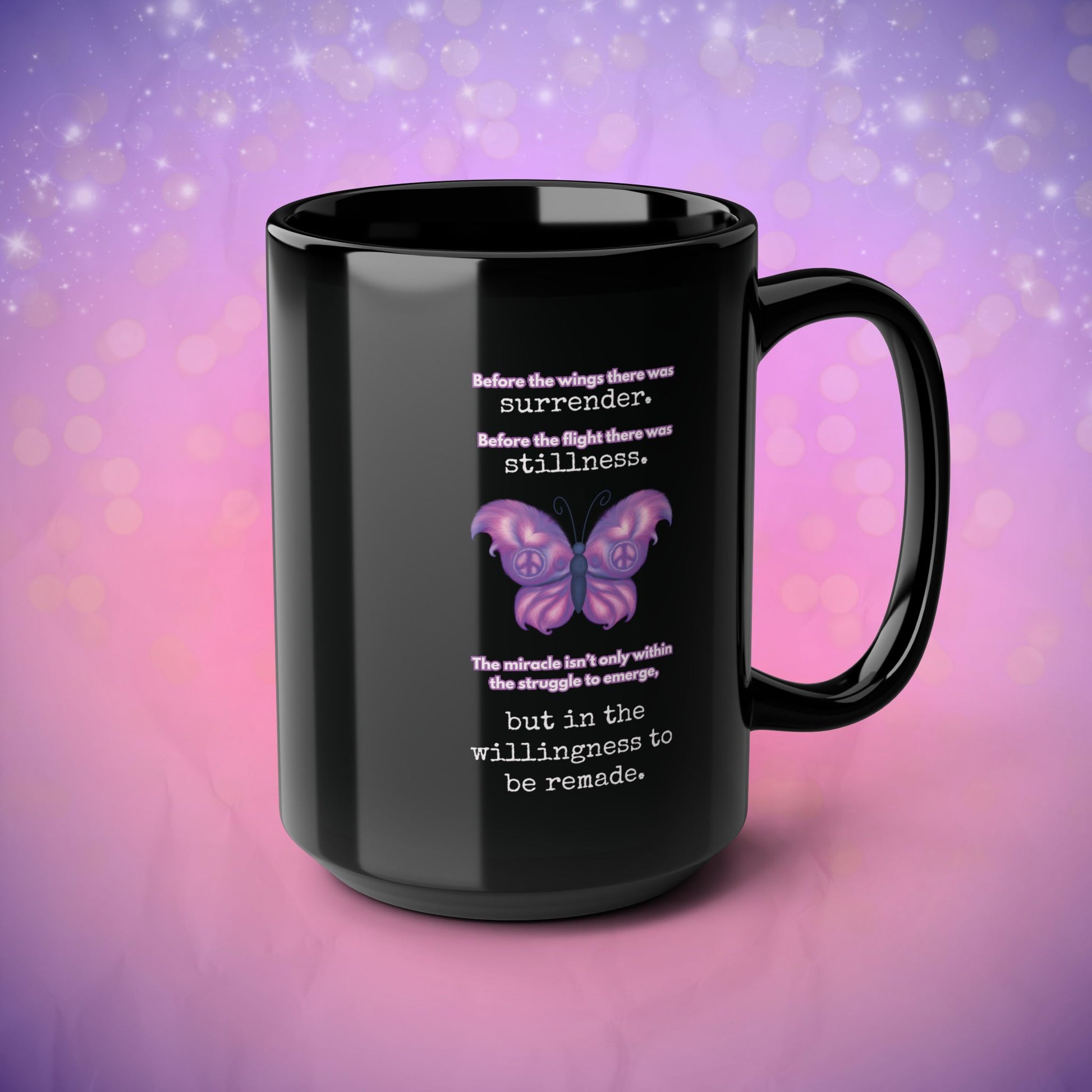 Black mug with butterfly design and motivational quote on a purple and pink gradient background