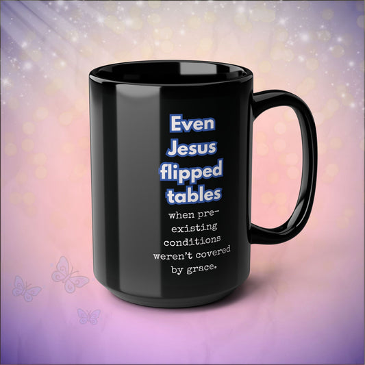 Black mug with humorous text design on a gradient background