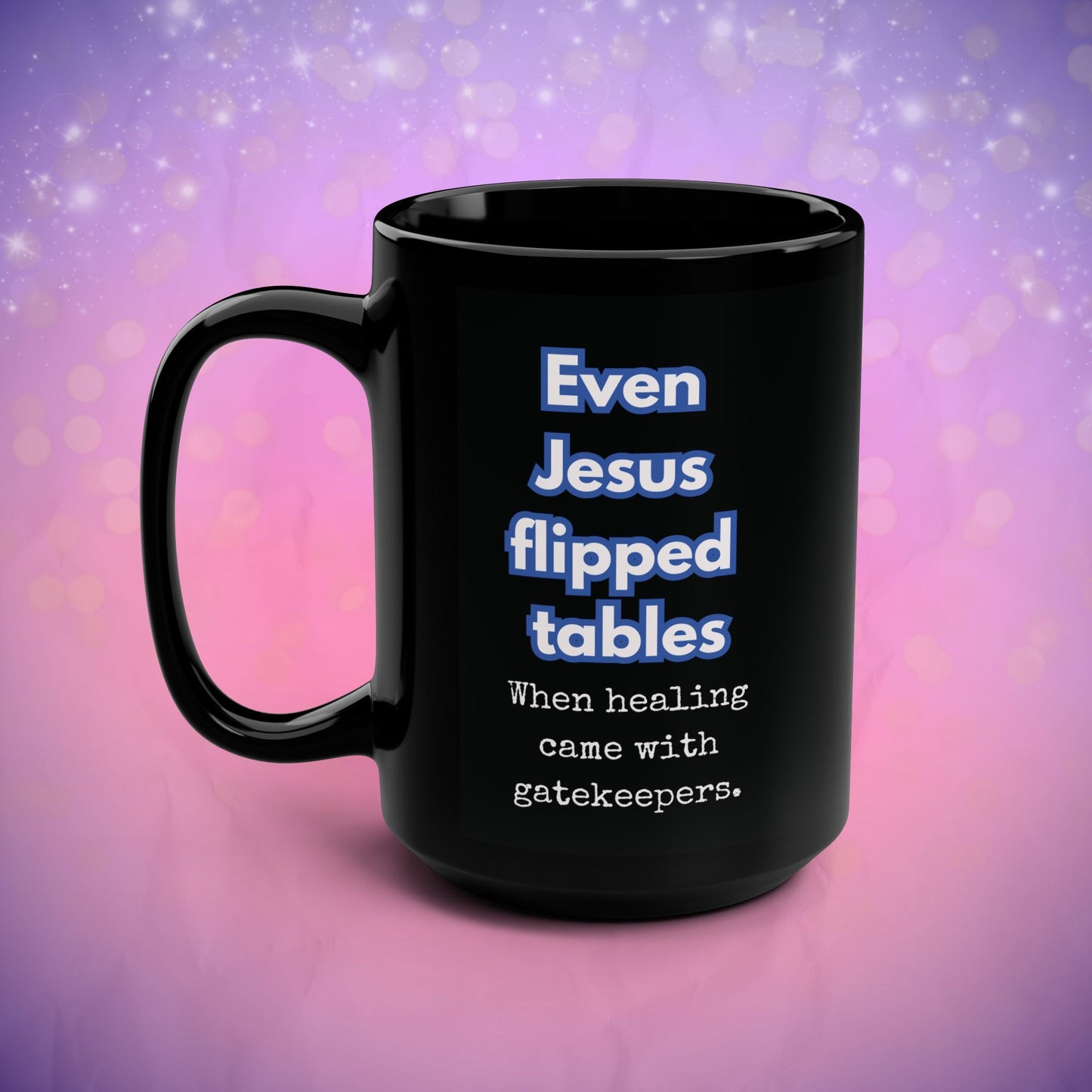 Black mug with humorous text on a gradient purple and pink background