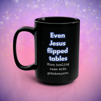 Black mug with humorous text on a gradient purple and pink background