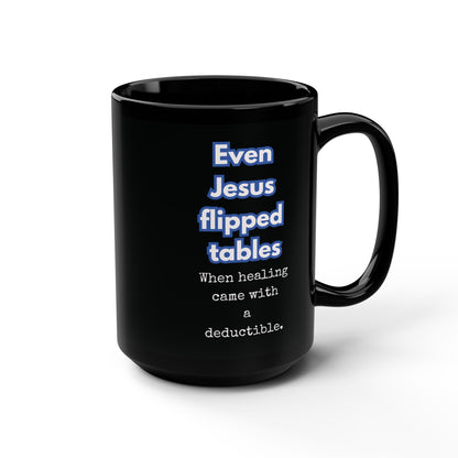 Black mug with humorous text design on a white background