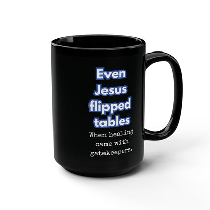 Black mug with humorous text design on a white background