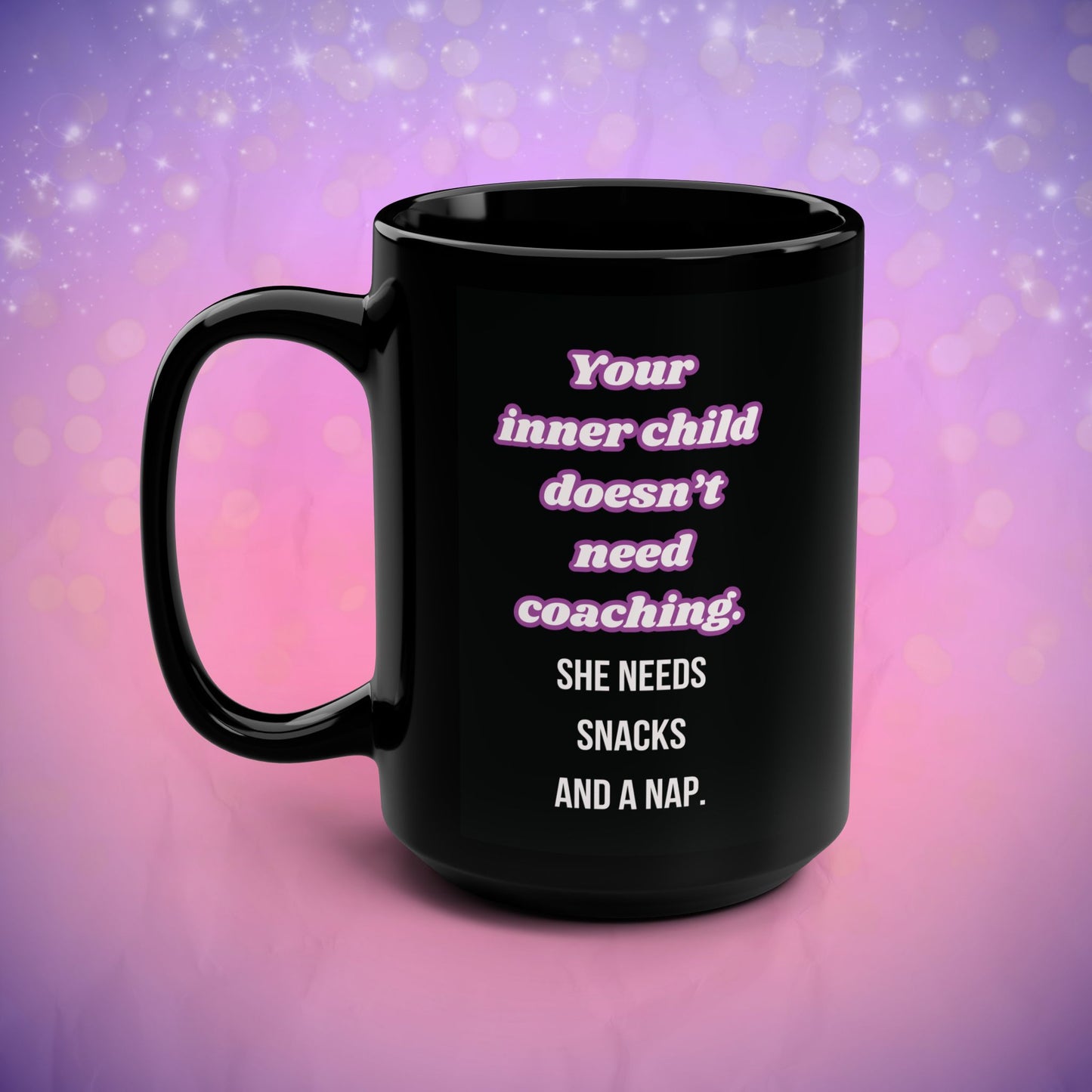 Black mug with humorous text on a pink and purple gradient background