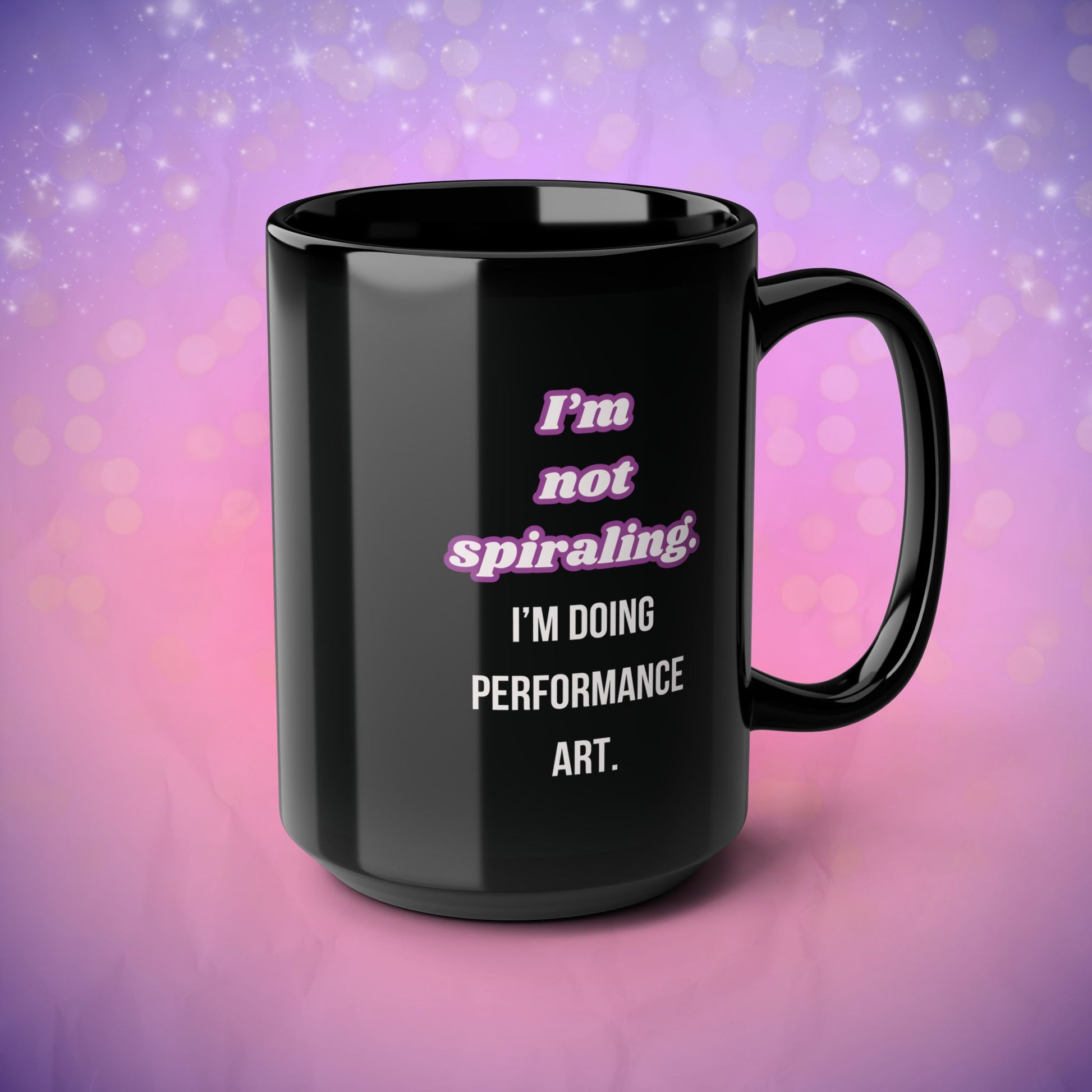 Black mug with humorous text design on a gradient purple and pink background
