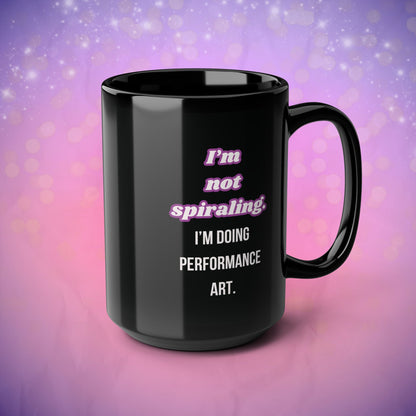 Black mug with humorous text design on a gradient purple and pink background