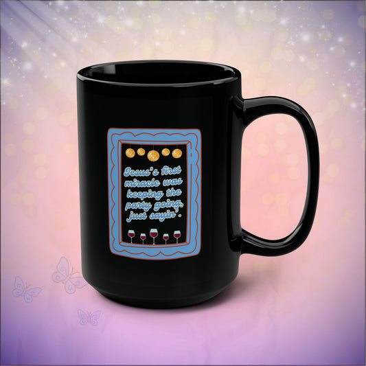 Black mug with a decorative design and text on a soft, multicolored background
