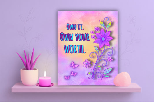 Decorative floral wall art print with the quote “Own It. Own Your Worth.” in bright lettering, surrounded by purple flowers and butterflies on a pastel gradient background; feminine empowerment art by Imagination Creations.