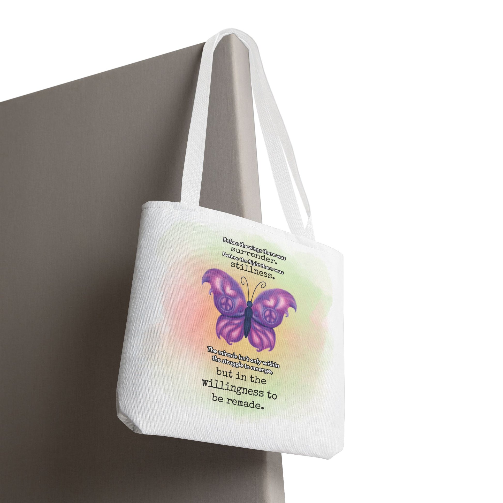 Tote bag with a purple butterfly design and text on a white background