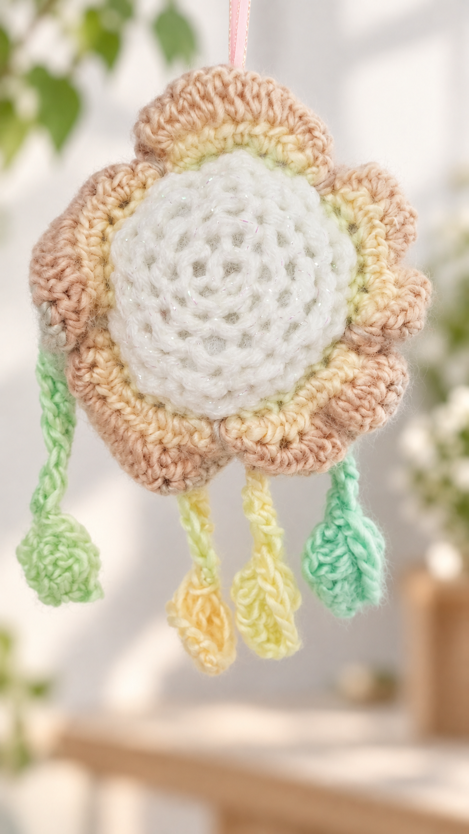 Rear view of Mellow Marigold showing the white and golden crochet petal back structure and pink loop.
