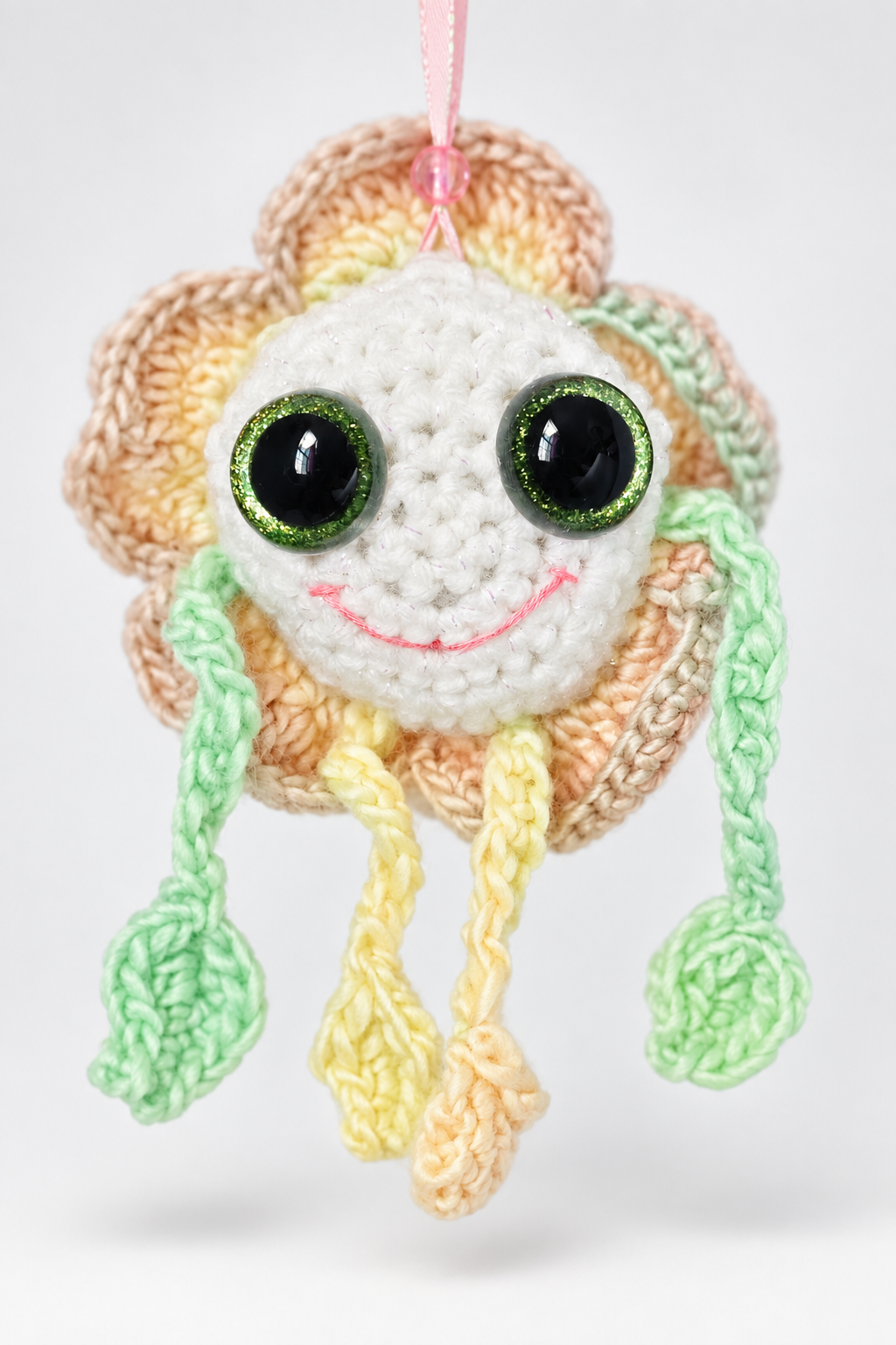 Isolated studio photo of Mellow Marigold handmade crochet decorative flower keepsake.