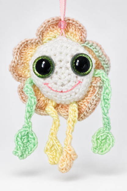 Isolated studio photo of Mellow Marigold handmade crochet decorative flower keepsake.